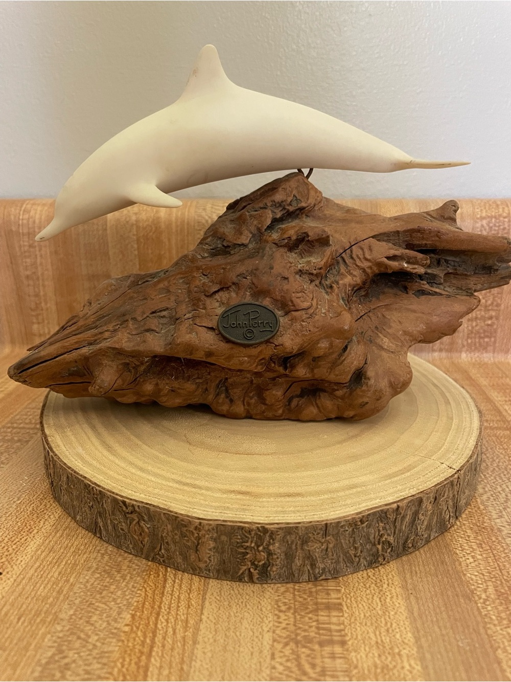 White Dolphin Sculpture on Driftwood Base